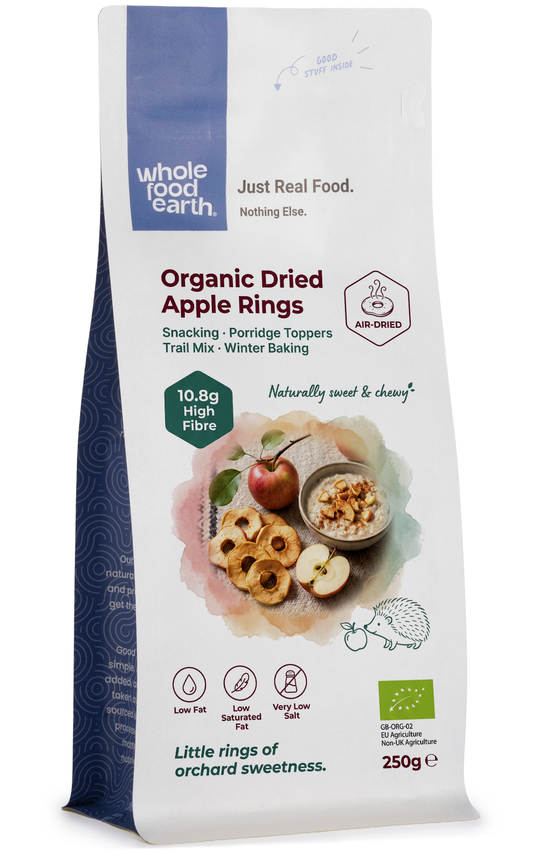 Organic dried apple rings from Whole Food Earth, natural dried fruit slices with vibrant color and textured surface.