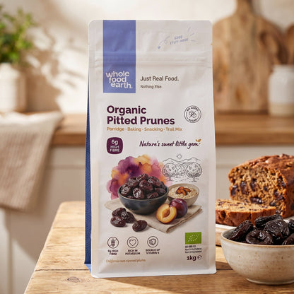 Organic pitted prunes from Whole Food Earth, dried fruits with smooth, dark, and chewy texture, ready for snacking or recipes.