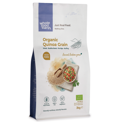 Organic quinoa grain from Whole Food Earth in a clear container, showing light beige, small round quinoa seeds.