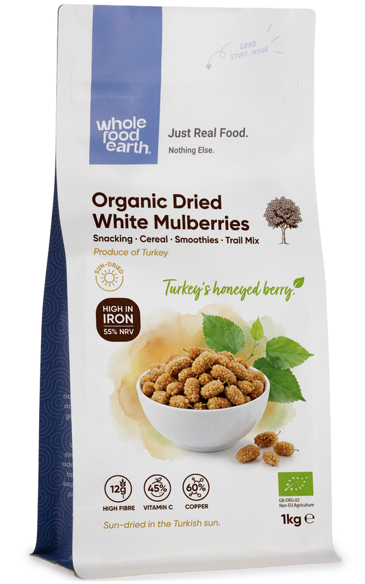 Organic white mulberries in a clear glass bowl, dried fruit, from Whole Food Earth, showcasing their white, wrinkled appearance.