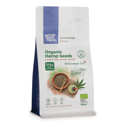 Organic hemp seeds from Whole Food Earth, showing a close-up of the greenish seeds in a bowl on a wooden surface.