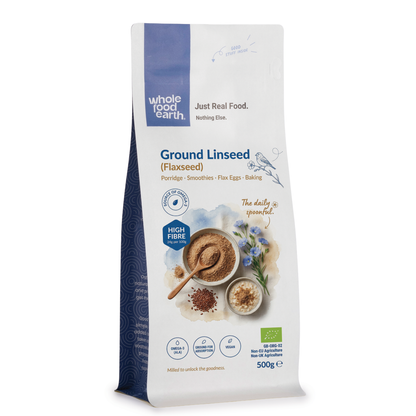 Organic ground flaxseed from Whole Food Earth, shown in a clear container with loose flaxseeds visible, on a neutral background.