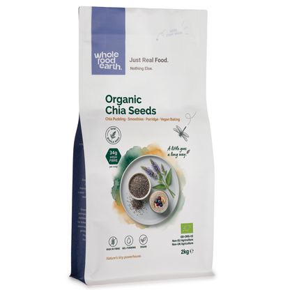 Organic chia seeds in a clear glass jar, showing small black and white seeds from Whole Food Earth, nuts and seeds product.