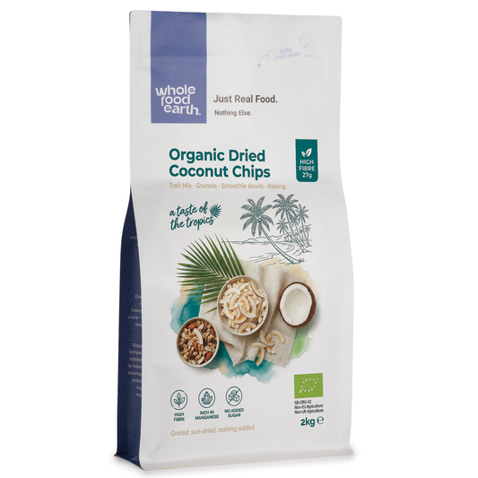 Organic dried coconut chips from Whole Food Earth, crispy dried fruits with shredded coconut slices in a clear bowl.