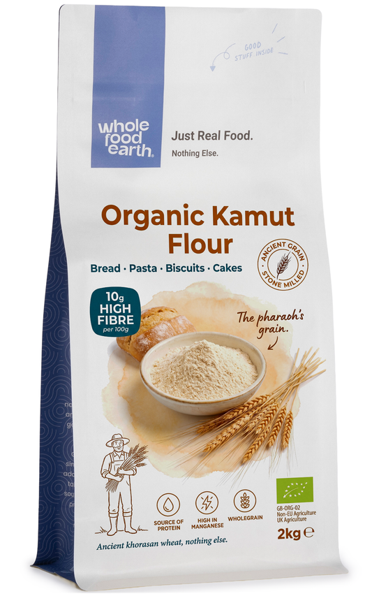 Organic Kamut flour in a clear bag from Whole Food Earth, showing the light brown, coarse textured grains inside.