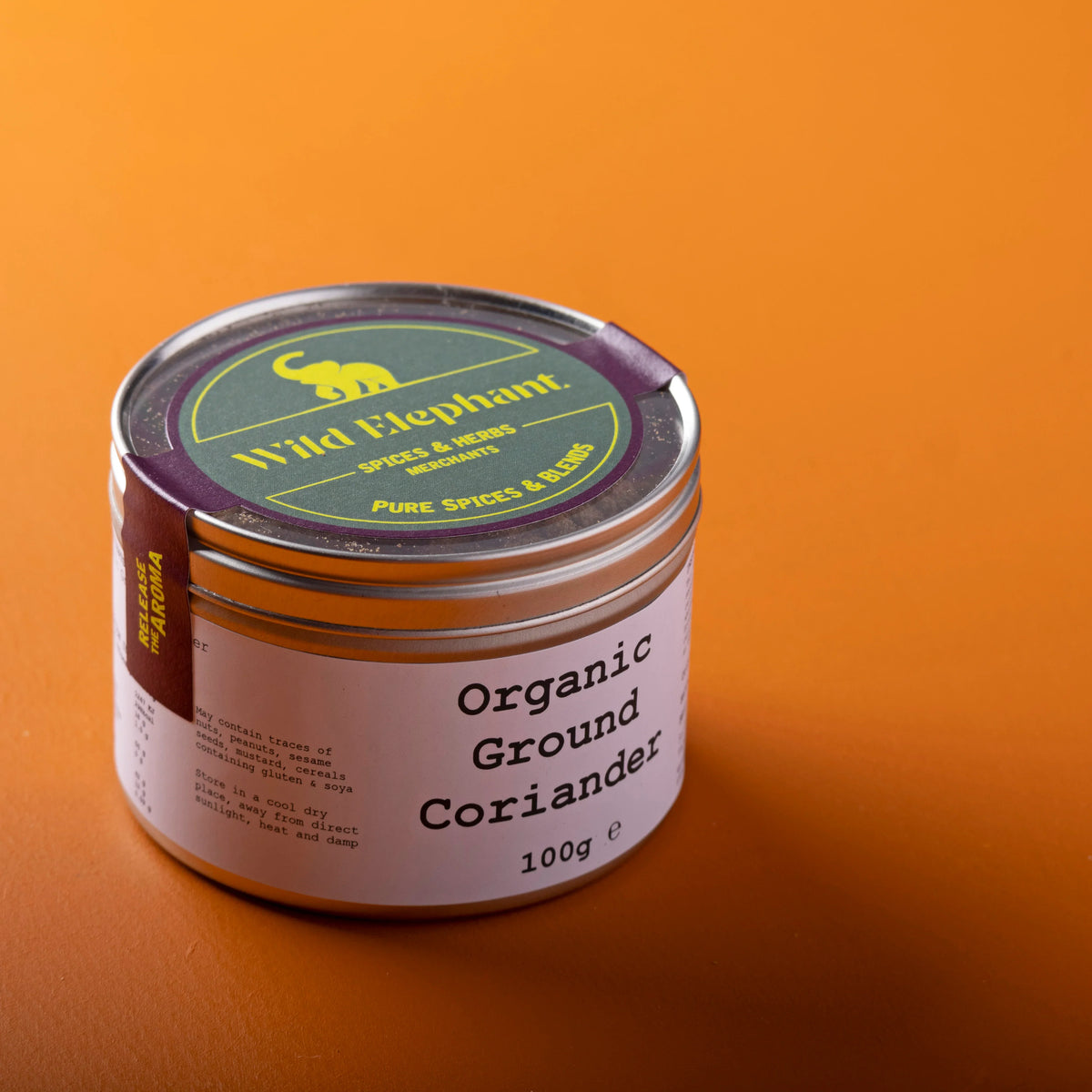 Organic ground coriander herb from Whole Food Earth, 100g, with fresh, fragrant coriander seeds in a resealable package.