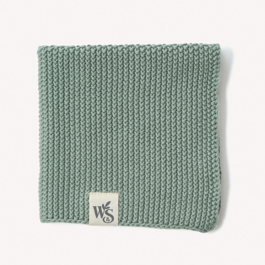 Organic cotton dishcloth by Wild And Stone, showing a soft, absorbent kitchen dish cloth with a woven texture.