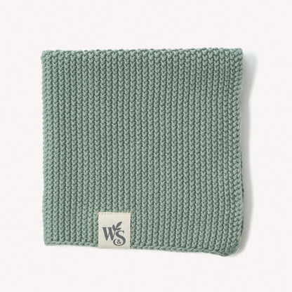 Organic cotton dishcloth by Wild And Stone, showing a soft, absorbent kitchen dish cloth with a woven texture.
