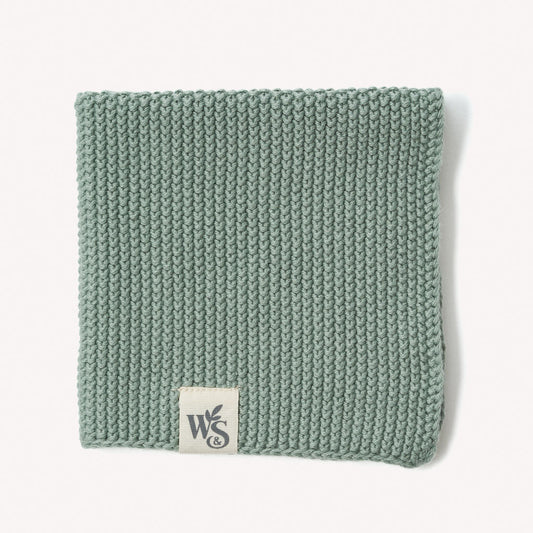 Organic cotton dishcloth by Wild And Stone, showing a soft, absorbent kitchen dish cloth with a woven texture.