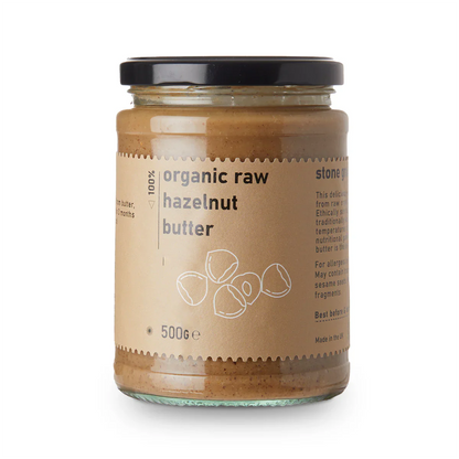 Organic raw hazelnut butter from Whole Food Earth, spread in a jar, showcasing smooth, creamy texture and natural hazelnut color.