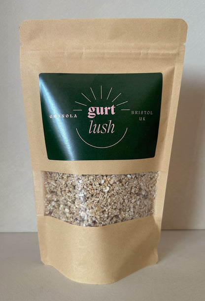 Honey and vanilla granola from Gurt Lush Food Co shown in a close-up of a bowl with granola chunks and vanilla beans.