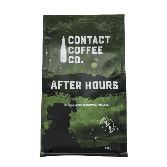 A cup of After Hours Coffee from ArtisanBox, featuring a steaming mug of dark roasted coffee on a wooden table.