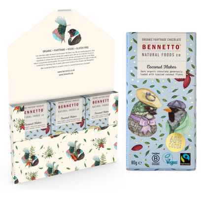 Bennetto Natural Foods UK chocolate coconut flakes in a 6-pack, close-up of the coconut-flavored chocolate pieces.