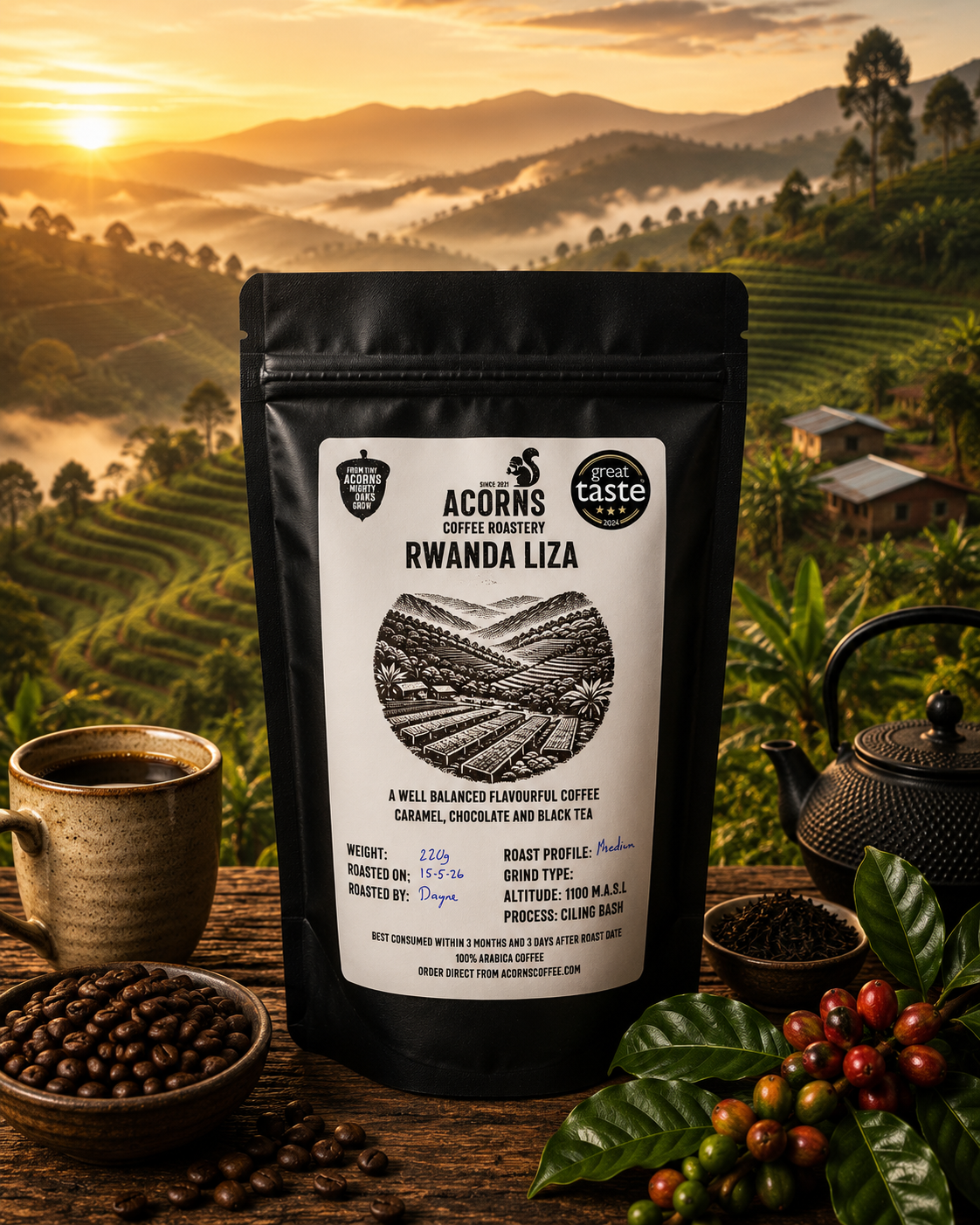 Acorns Coffee & Cake Rwanda Liza medium roast coffee packaging with scenic thousand hills background, showcasing premium coffee beans.