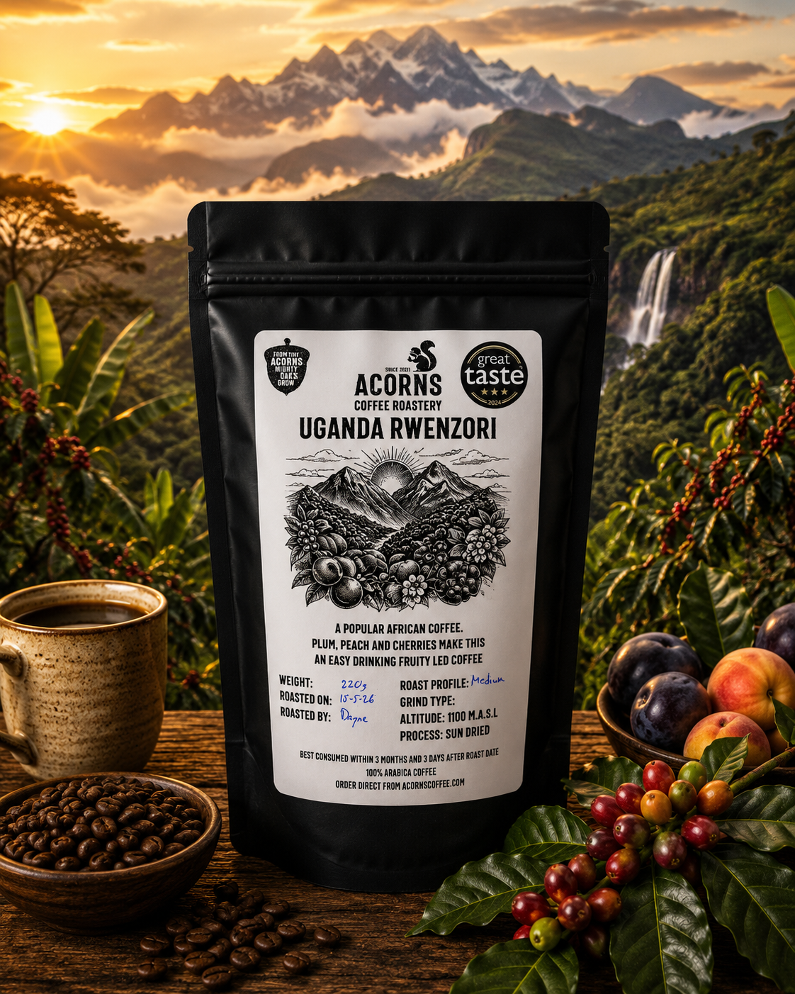 Medium roast Uganda Rwenzori coffee by Acorns Coffee & Cake in packaging featuring scenic imagery and fruity flavor notes.