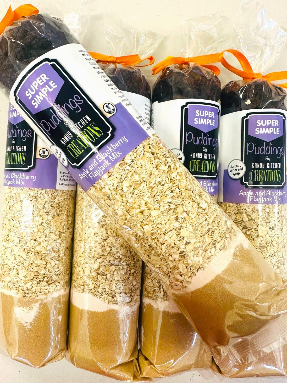 Crafty Cook apple and blackberry flapjack mix in a bowl, gluten-free ingredients with fresh fruit pieces visible.