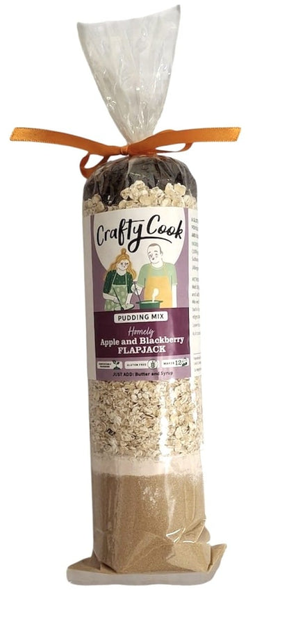Gluten-free apple and blackberry flapjack mix by Crafty Cook, showing a bag of the all-purpose baking blend with fresh fruit.