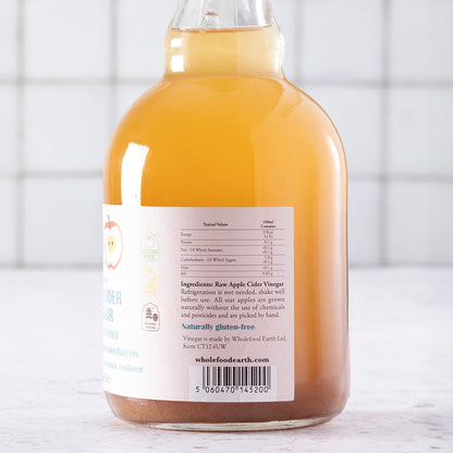 Whole Food Earth Kent Apple Cider Vinegar 4-pack bottles with "Mother," raw, unpasteurized, unfiltered, GMO-free, in clear bottles