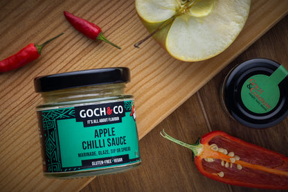 Goch & Co Celebration Hamper with assorted food items, including jars of apple sauce and other gourmet treats displayed.
