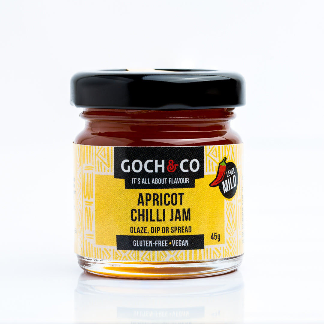 Jar of Goch & Co Apricot Chilli Jam with apricots and chili peppers visible, showcasing a vibrant, fruity and spicy condiment.