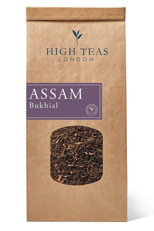 Loose leaf Assam Bukhial TGFOP tea from High Teas, showcasing dark, twisted tea leaves in a close-up image.