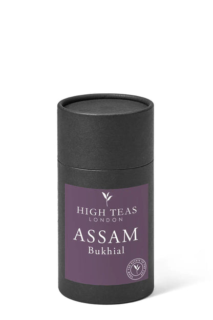 Loose leaf Assam Bukhial TGFOP tea from High Teas, showing dark amber leaves with golden tips in a close-up view.