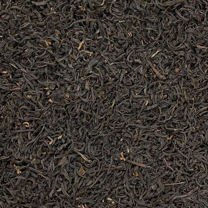 Assam Hunwal 2nd flush tea leaves from High Teas, showcasing fresh, whole tea leaves in a natural setting.
