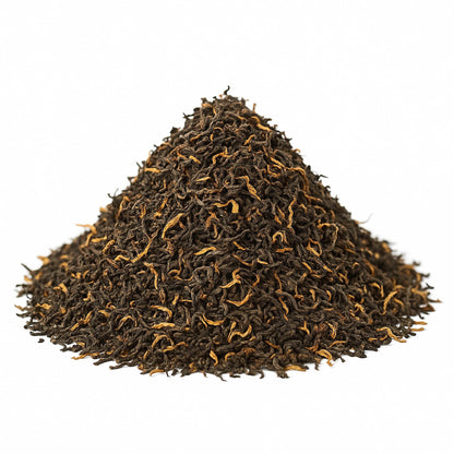 Assam Mangalam FTGFOP1 tea leaves from High Teas, shown in a neat pile with rich green and golden tips.