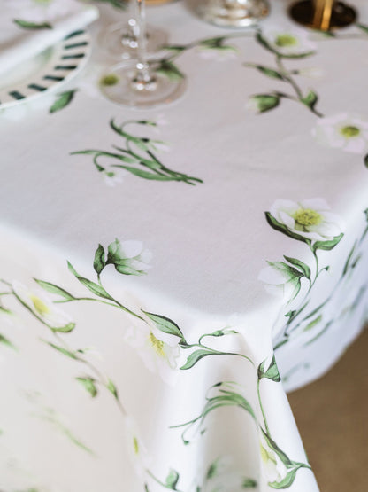 Snowdrop and hellebore floral tablecloth by Avalon Home UK, featuring a spring-inspired botanical design for elegant table decor.
