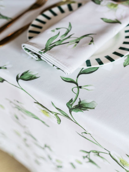 White snowdrop and hellebore floral tablecloth by Avalon Home UK, with spring and summer botanical design on fabric.