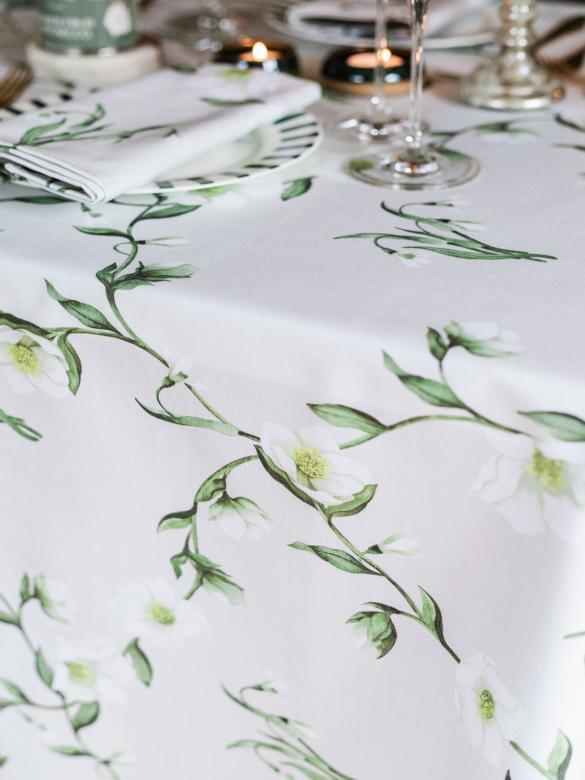 Snowdrop and hellebore floral tablecloth by Avalon Home UK with spring and summer botanical design on fabric.