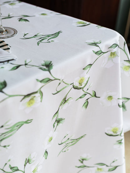 Snowdrop and hellebore floral tablecloth by Avalon Home UK, featuring a spring-inspired botanical design on a fabric surface