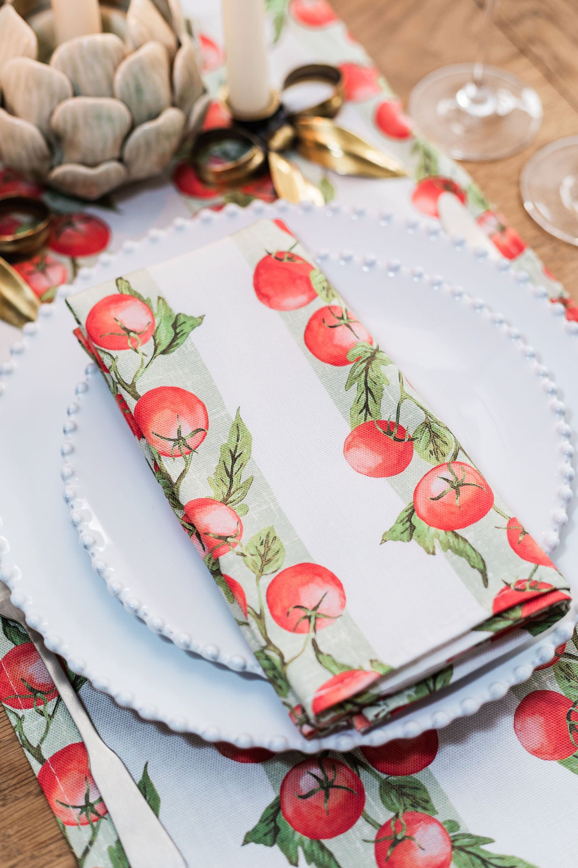 Pair of vine tomato patterned napkins from Avalon Home UK, featuring fresh tomato design on soft fabric.