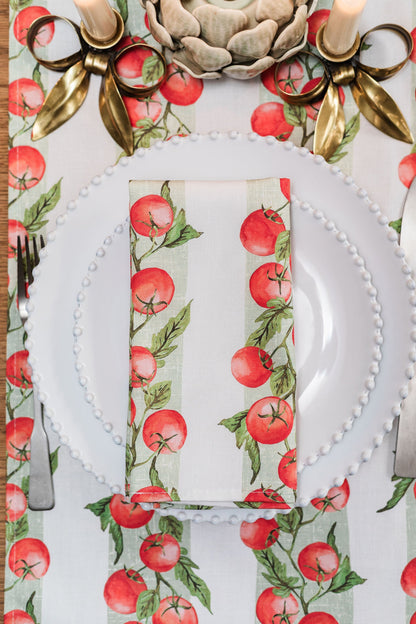 Pair of Vine Tomato napkins by Avalon Home UK featuring fresh tomato vine pattern on soft fabric for table decor.