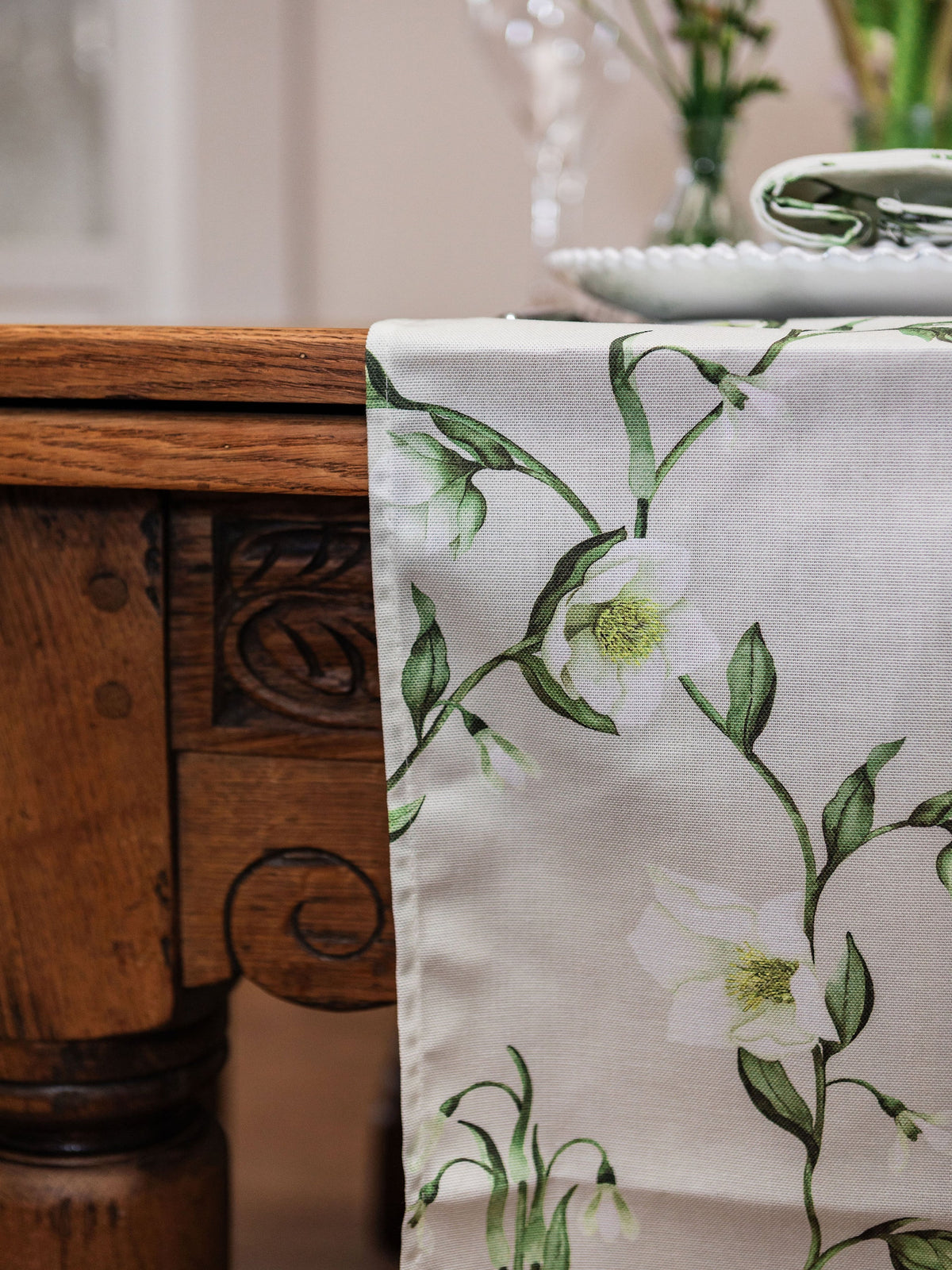 Spring-themed table runner featuring snowdrop and hellebore floral design by Avalon Home UK, perfect for spring decor.