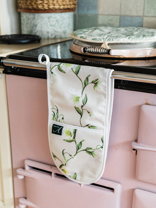 Avalon Home UK snowdrop and hellebore oven glove with floral design, ideal for kitchen use, in a spring and summer themed setting.