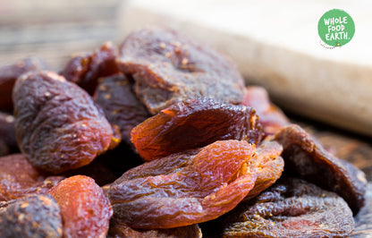 Dried whole apricots from Whole Food Earth, natural dried fruit with vibrant orange color and textured surface.