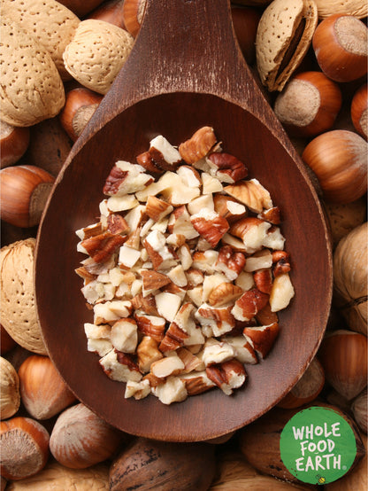 Mixed chopped nuts from Whole Food Earth, showcasing a variety of crunchy, chopped nuts and seeds in a clear bowl.