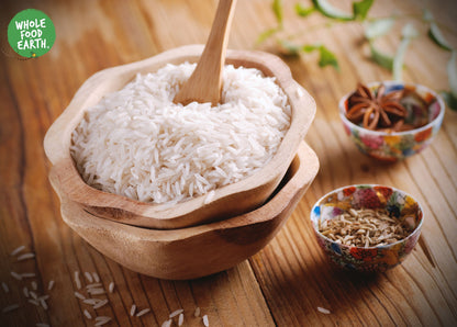 Long grain white rice from Whole Food Earth, showing a close-up of uncooked Patna rice grains in a bowl or bag.
