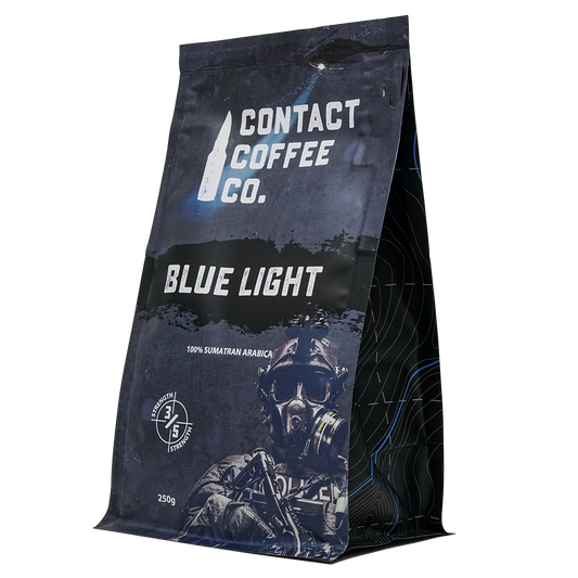 Blue Light Coffee from Contact Coffee Company Ltd., a fresh brewed coffee in a mug with a blue light background.