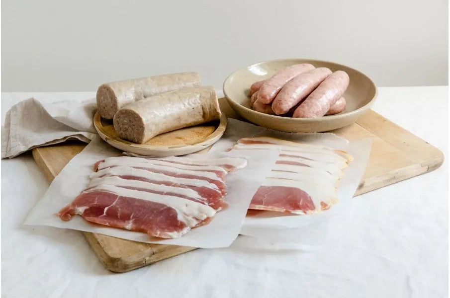 Primrose Herd Cornish Heritage Pork Family Breakfast Box with assorted meats for breakfast, including sausages and bacon.