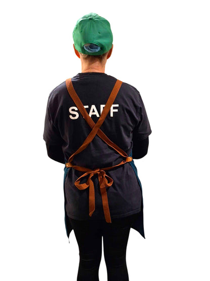 Back view of Crafty Cook apron with multiple pockets, designed for practical cooking and baking tasks.