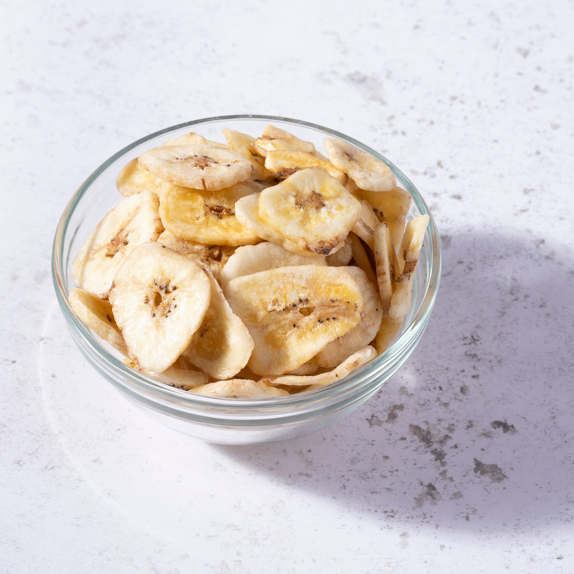 Sweetened banana chips from Whole Food Earth, dried fruit snack with golden banana slices showing a crispy texture.