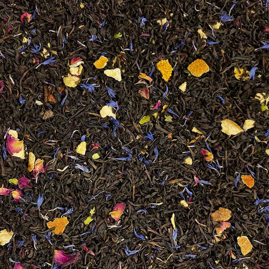Loose leaf Baroness Grey Blend tea by High Teas, with grayish tea leaves and citrus peels in a clear glass container.