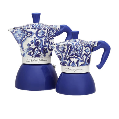 Bialetti Blue Mediterranean Moka coffee maker from Dolce&Gabbana collection on induction stove, showcasing sleek blue hardware.