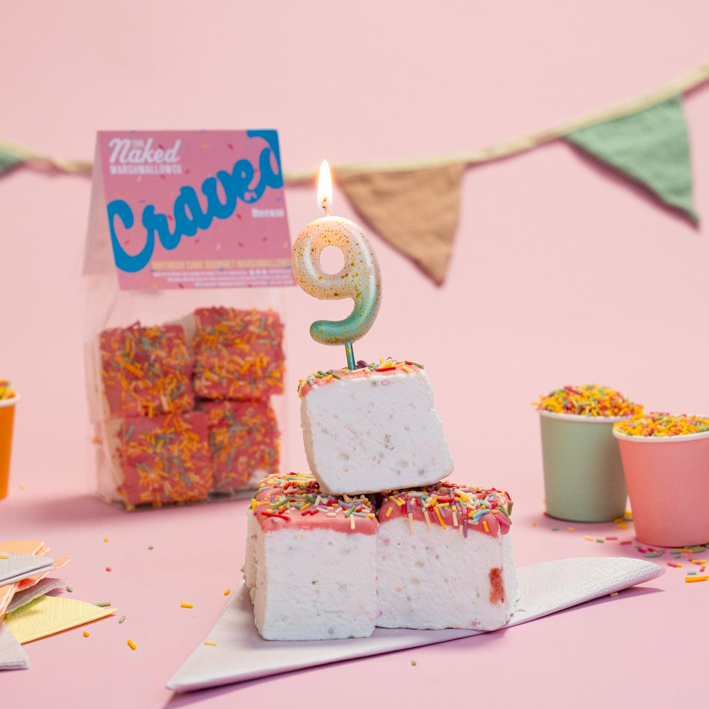Four colorful Craved Edition gourmet marshmallows from THE MARSHMALLOW FACTORY, decorated with birthday cake-inspired designs.