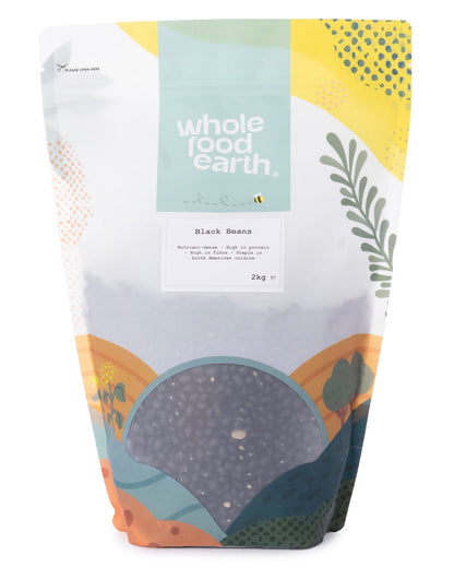 Two kilograms of Whole Food Earth black beans, dried beans and pulses, in a clear bag with label.