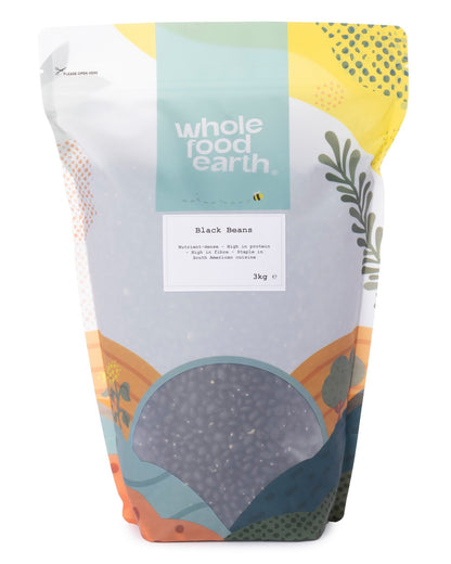 Whole Food Earth black beans in a 3kg bag, showing shiny, cooked black beans in a close-up view.
