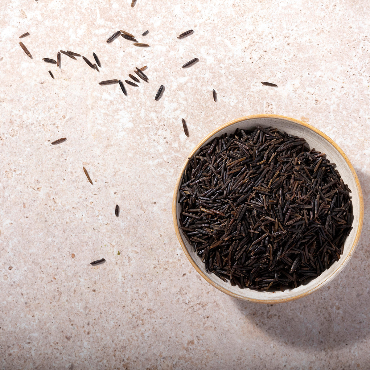 Black Wild Rice from Whole Food Earth, showing a close-up of the dark, elongated grains used in rice and couscous dishes.