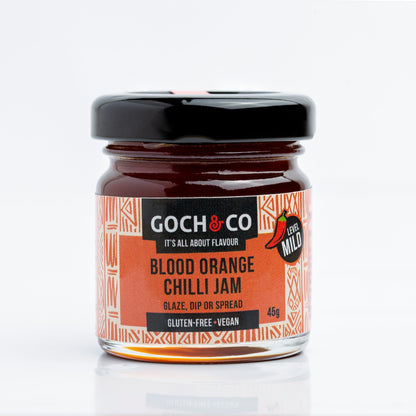 Jar of Goch & Co Blood Orange Chilli Jam showing the label and vibrant orange and red jam inside the glass jar.